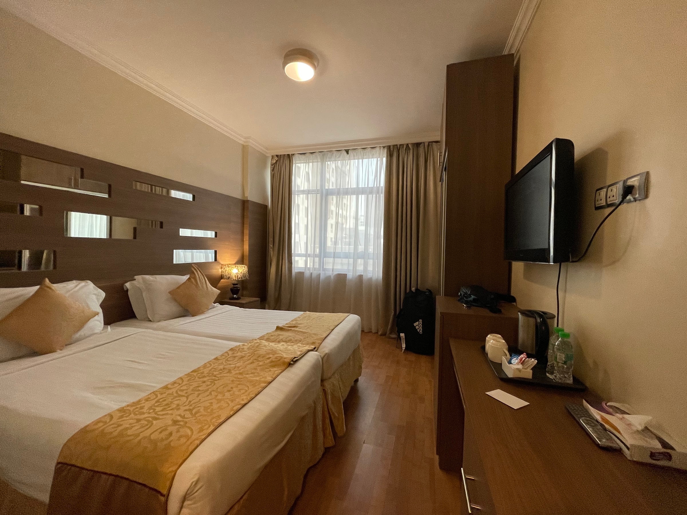 A room with two single beds