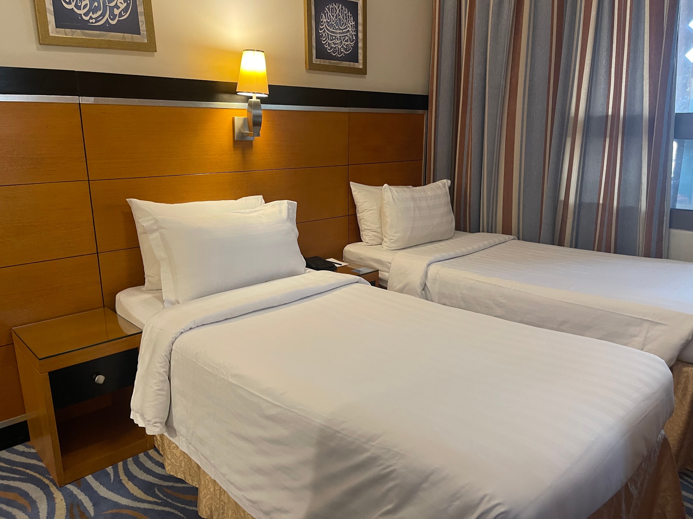A room with two single beds