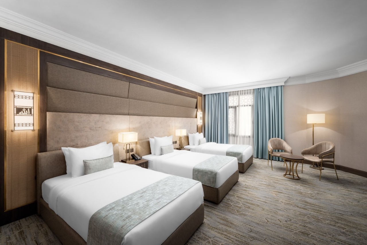 A room with three beds