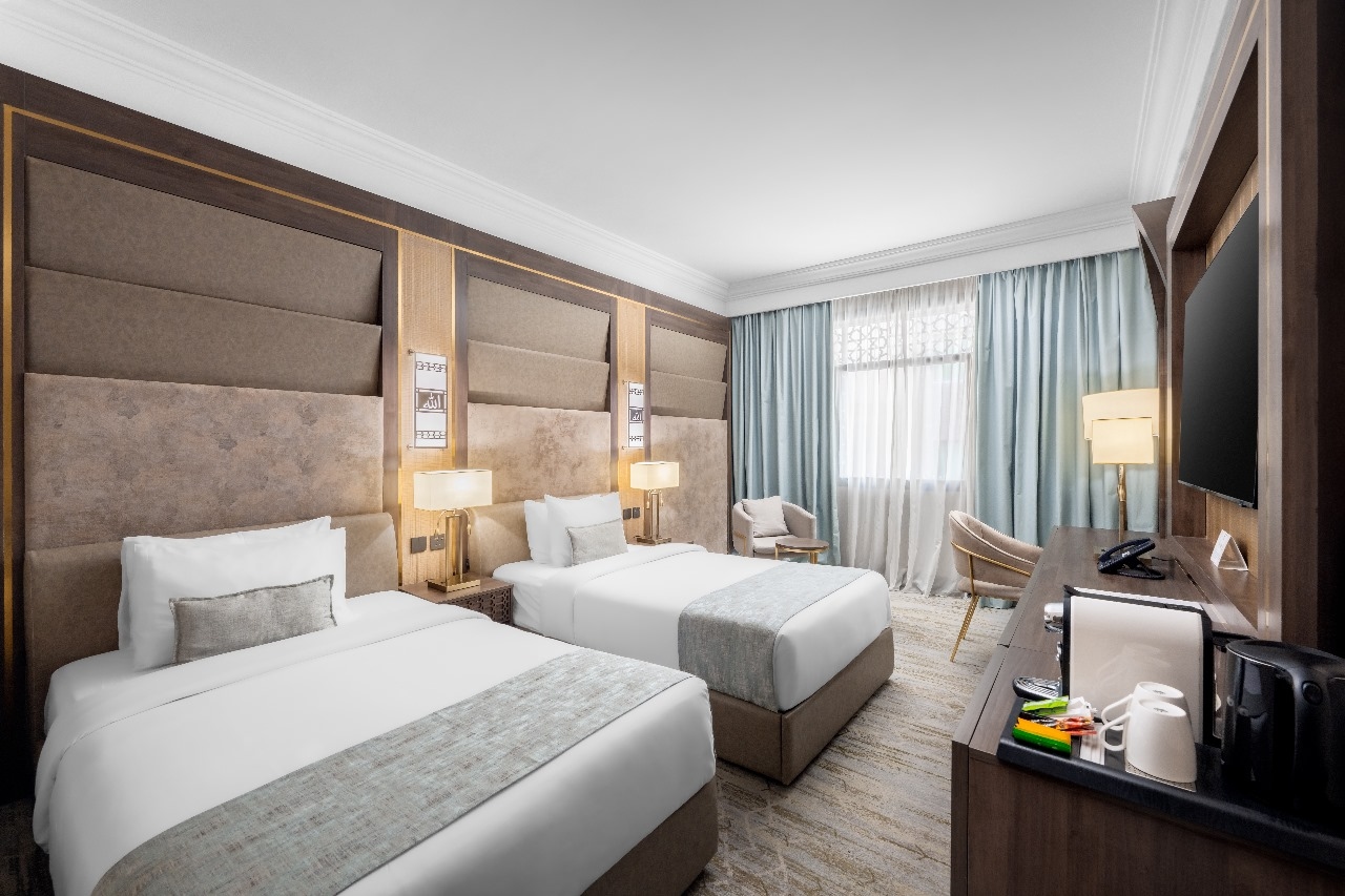 A room with two single beds