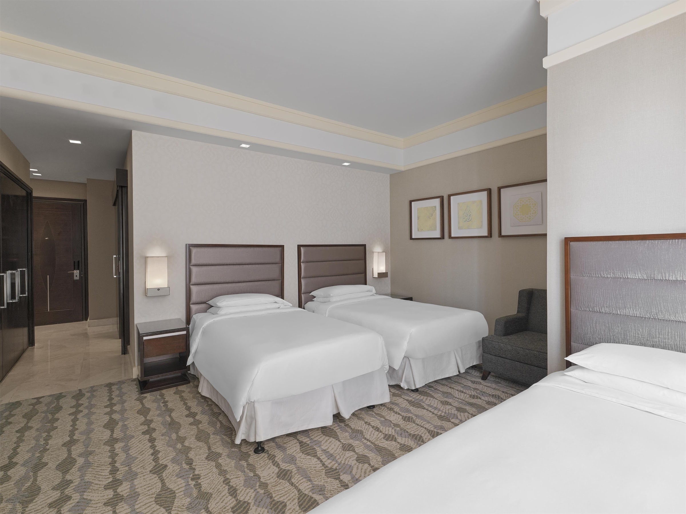 A room with three beds