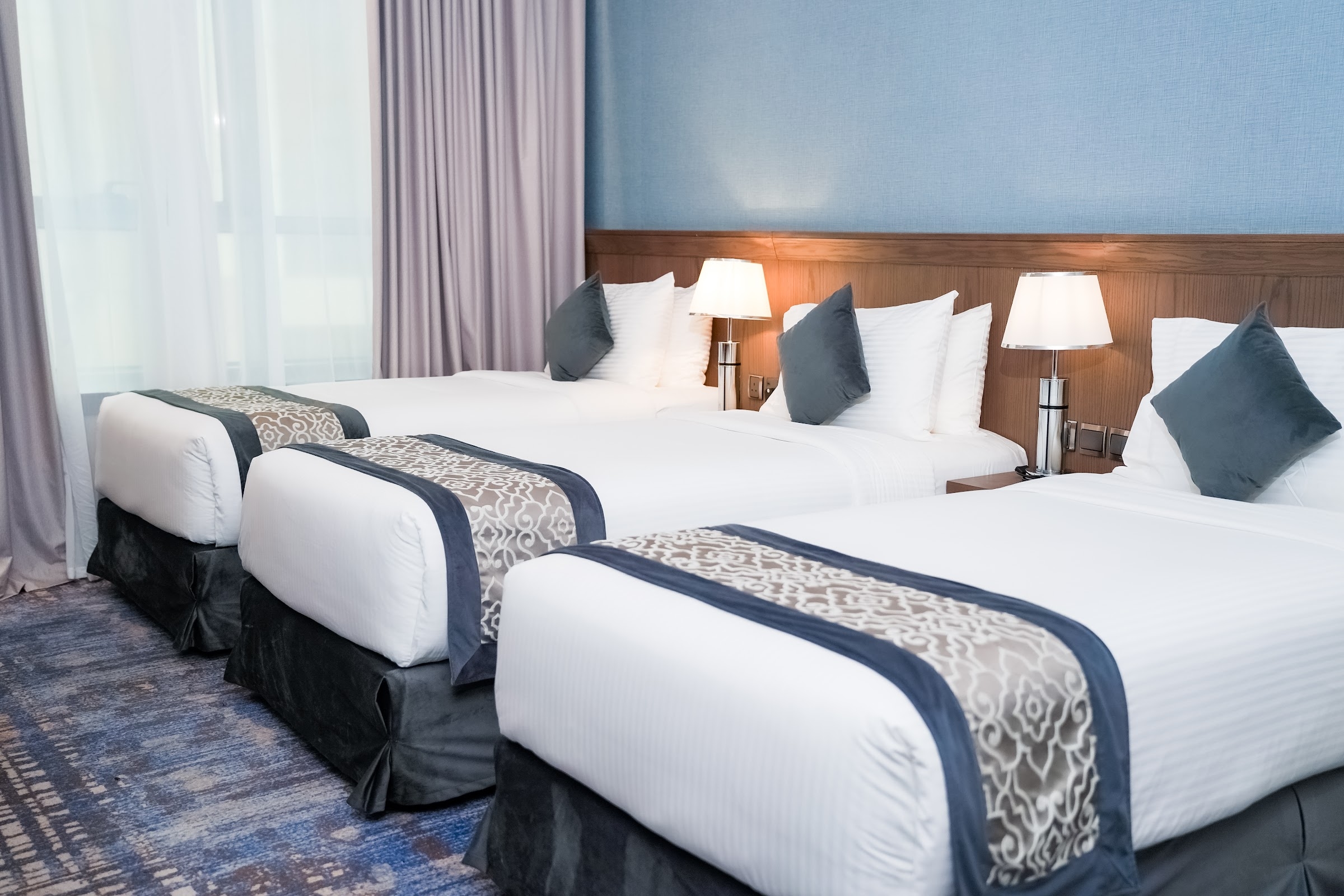A room with three beds