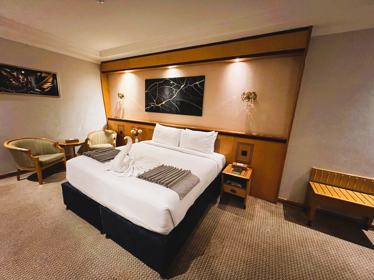 A room with one large bed