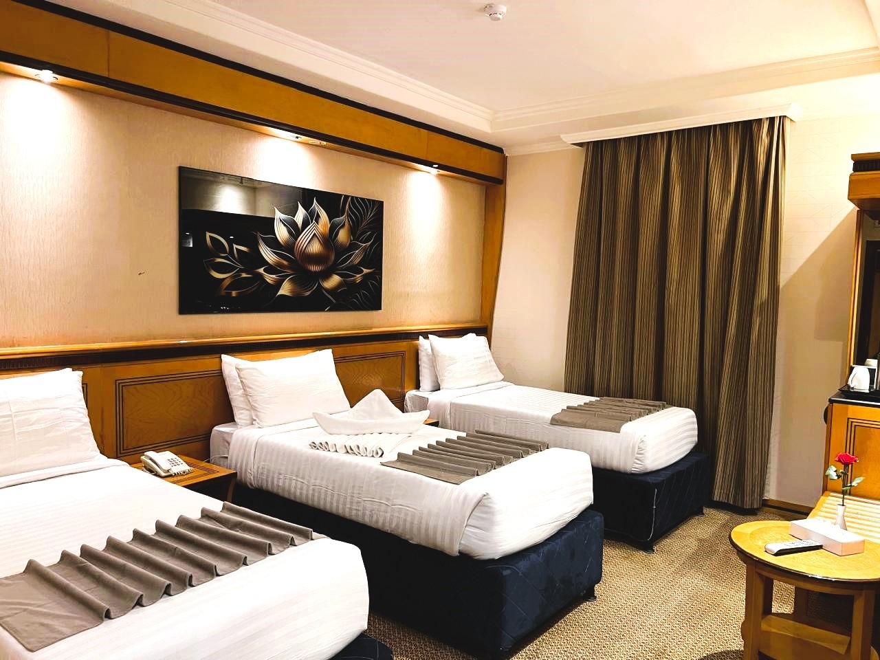 A room with three single beds