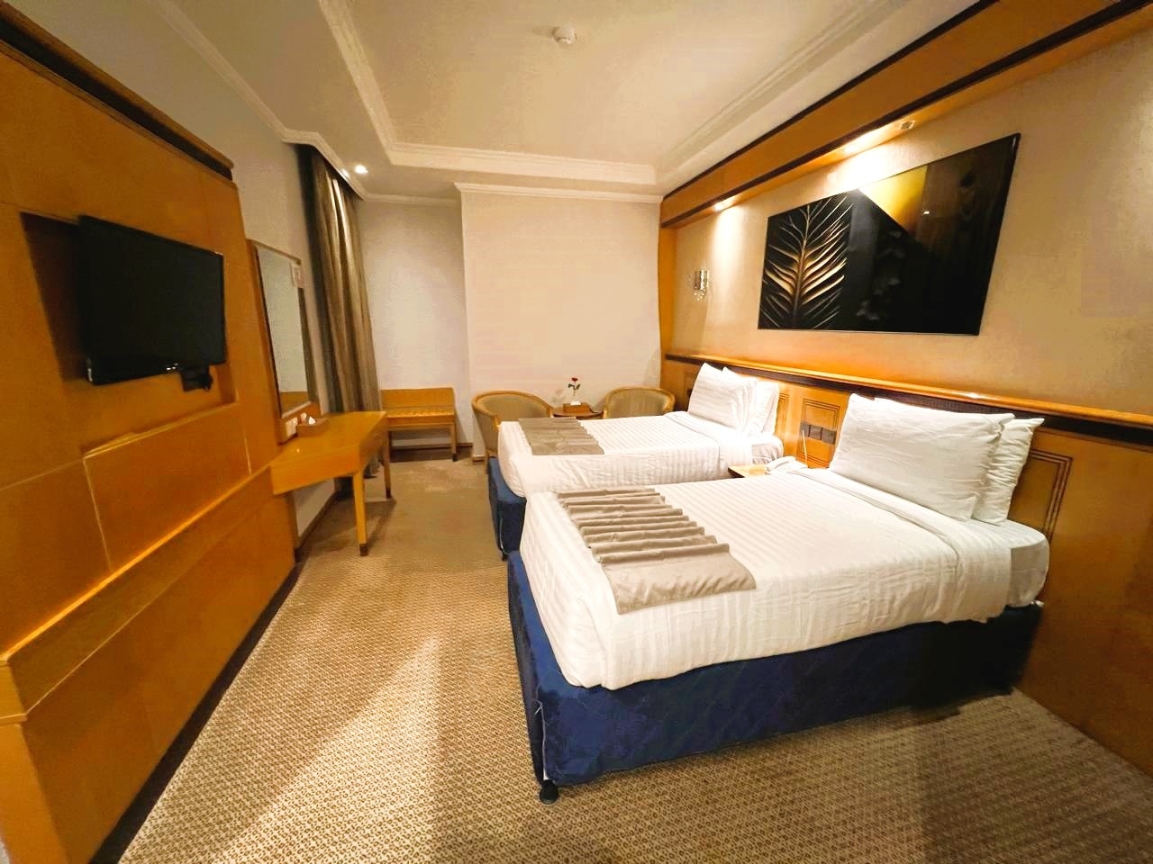 A room with two single beds
