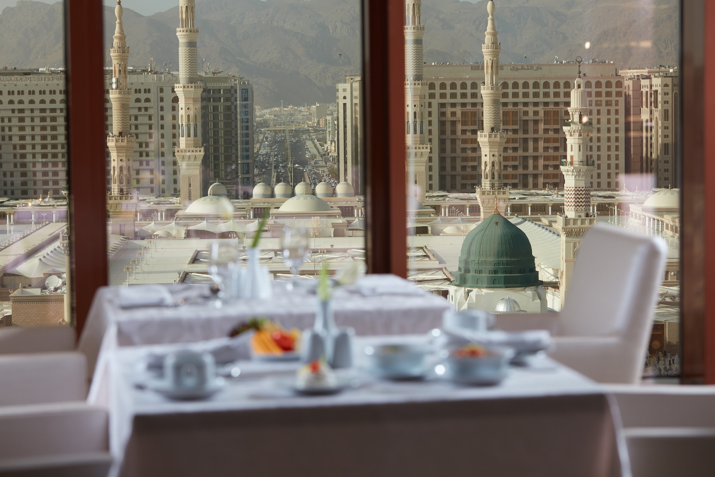 A breakfast table in a restaurant overlooking the Prophet's Mosque
