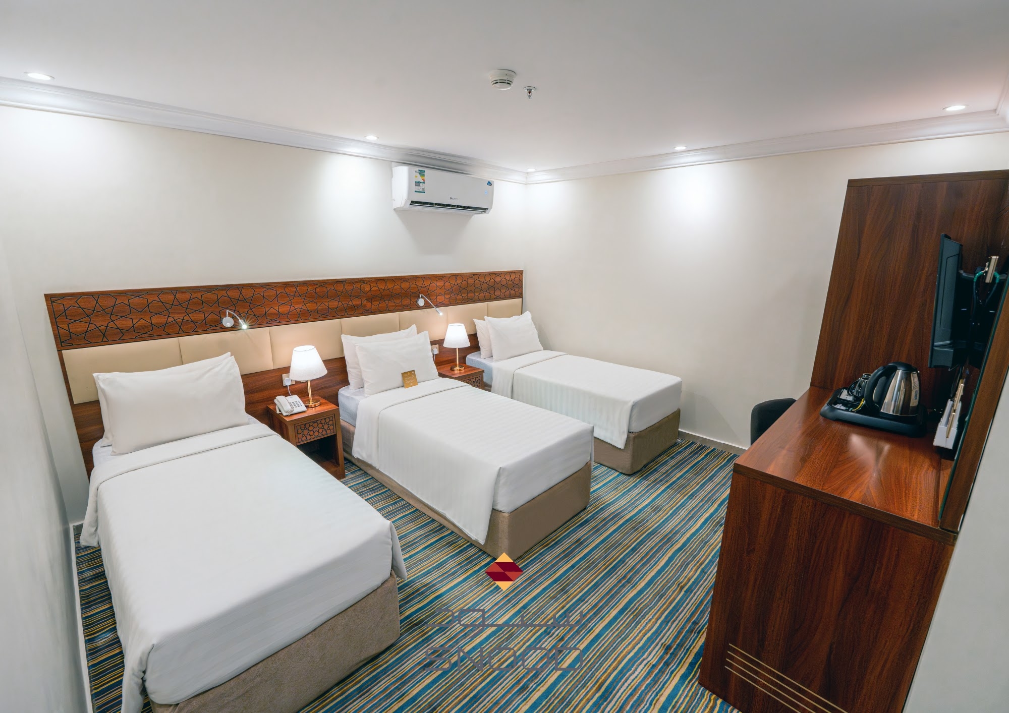 Kamar dengan tiga tempat tidur