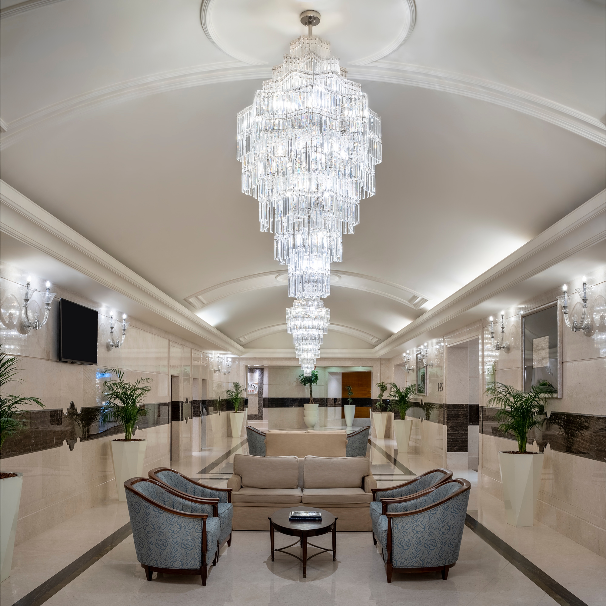 A seating area under the lobby's chandeliers