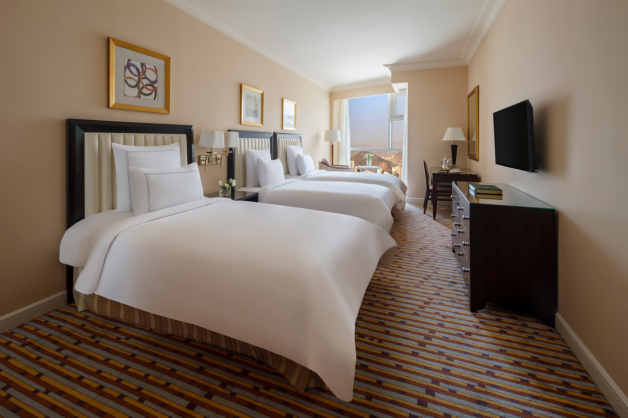 A room with three single beds