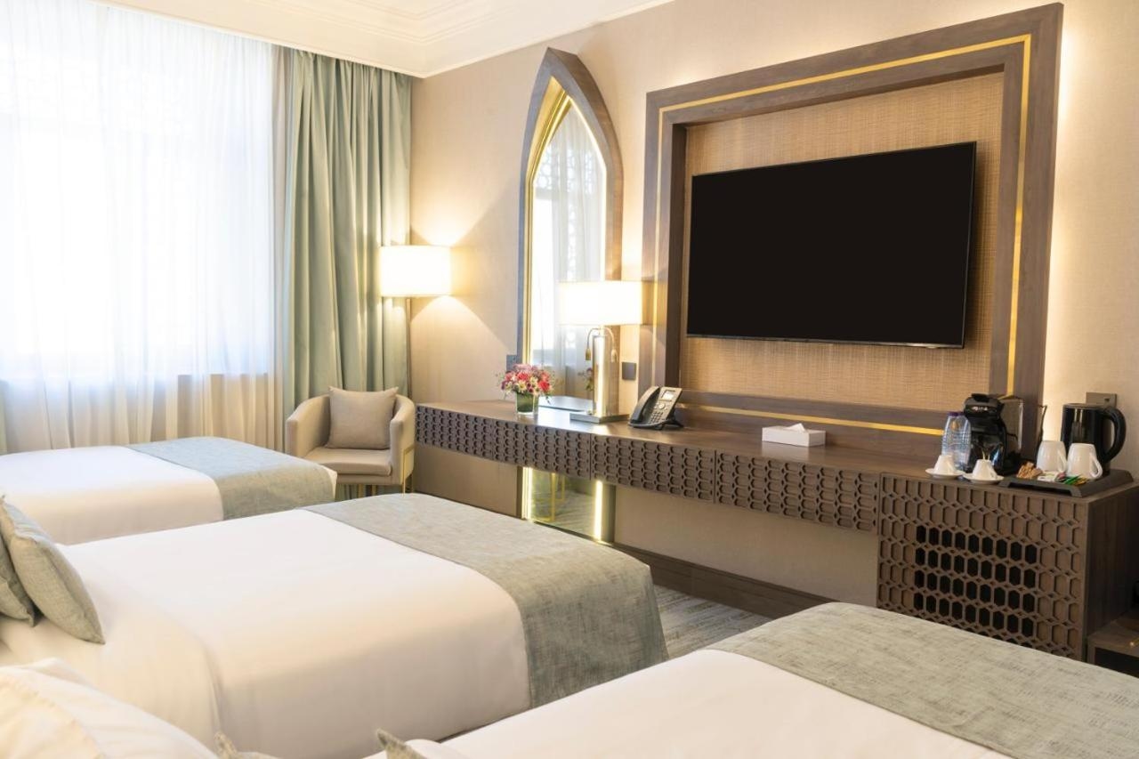 A room with three beds