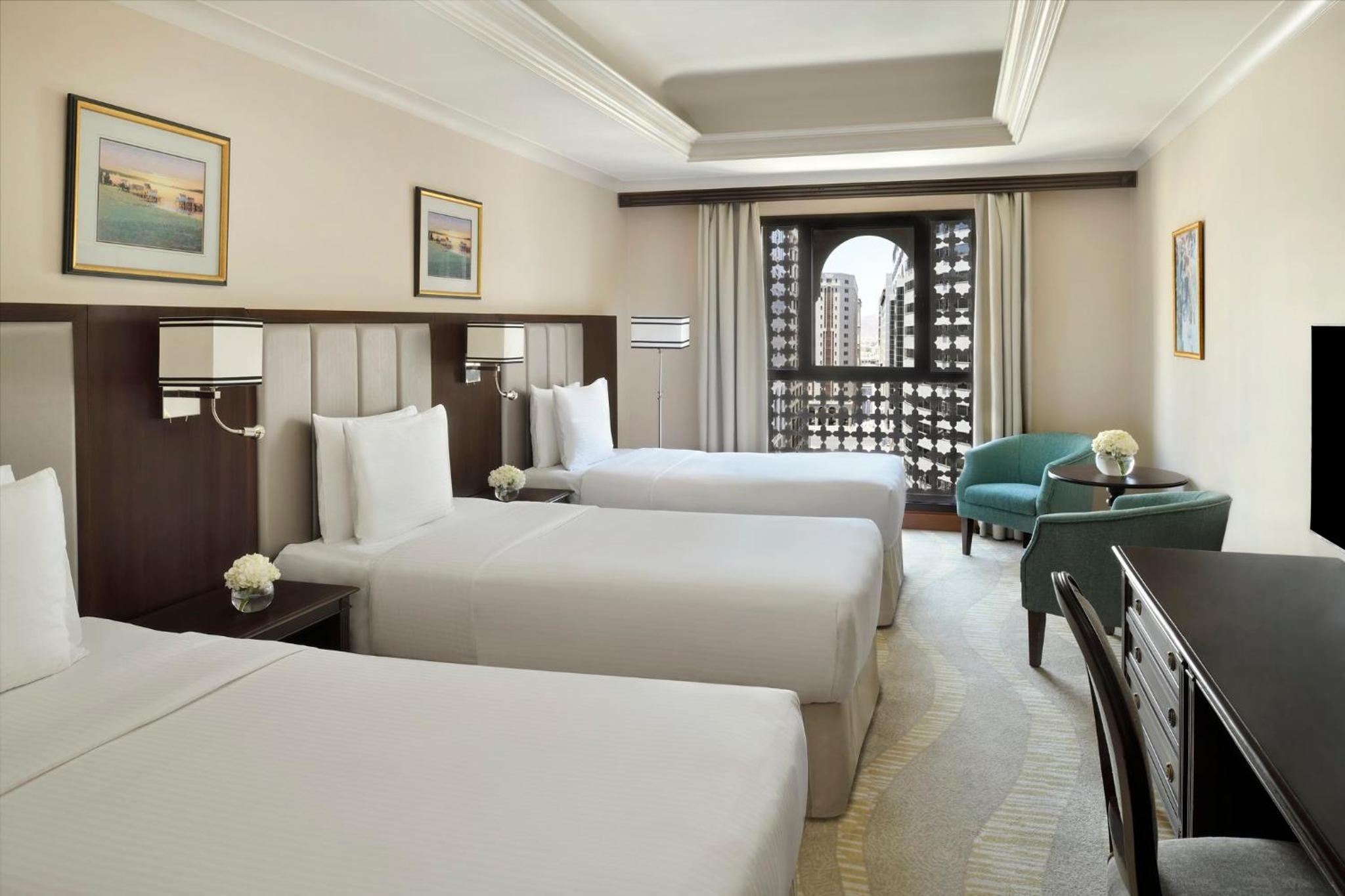 A room with three beds