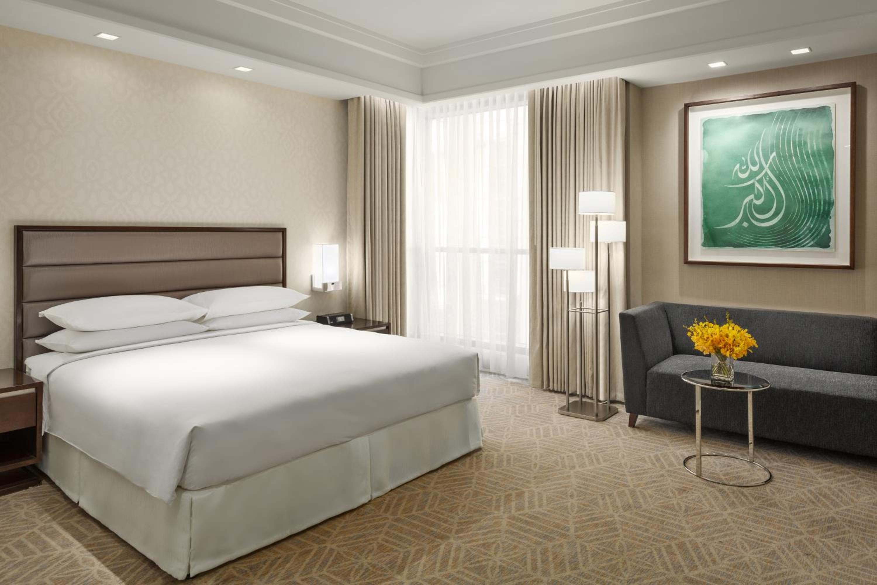 A room with a king bed