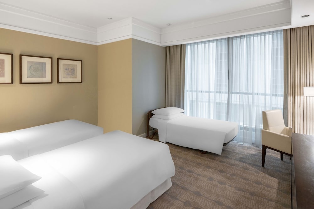 A room with three beds