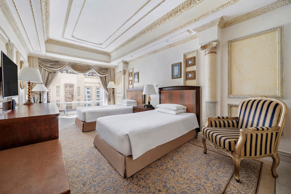 A room with two single beds