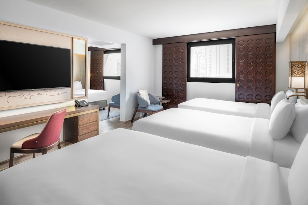 A room with three beds