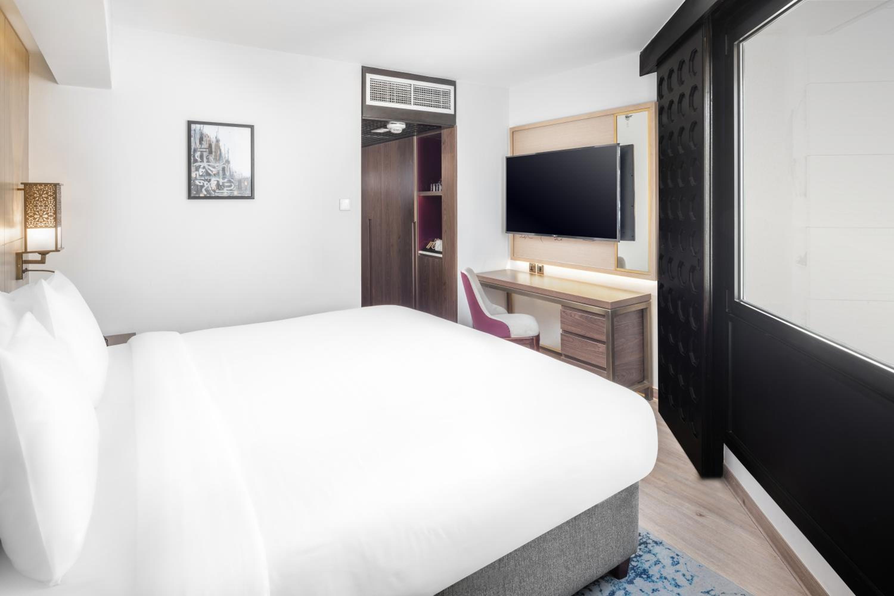 A room with a king bed