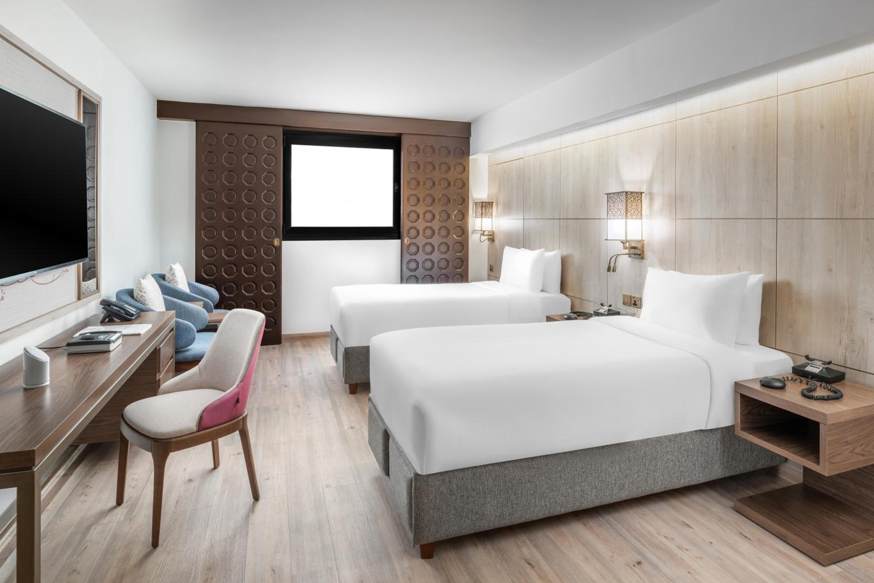 A room with two single beds